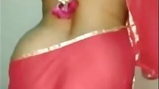 Hot desi bhabhi in a red sari exposes