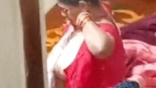 Aunty caught on hidden cam while dressing video