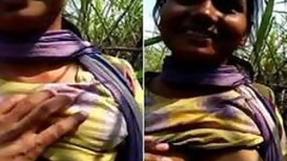 Enticing Indian chick allows boy to touch her XXX breasts outdoors