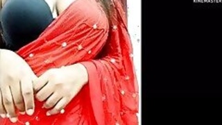 Super hot Desi bhabhi in red sari and black bra talking dirty to her boyfriend